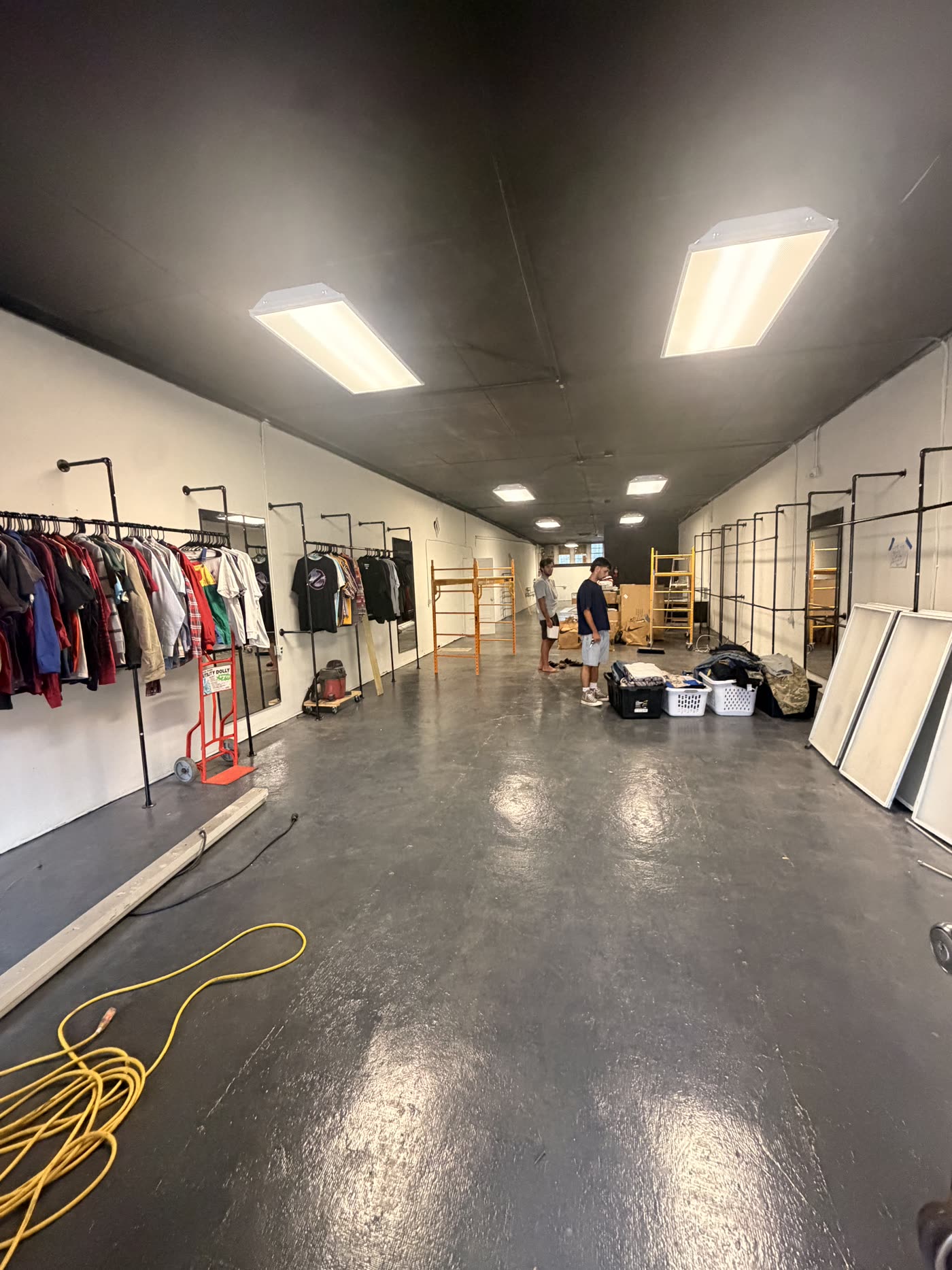 Nine99 store interior with recessed lighting and clothing racks