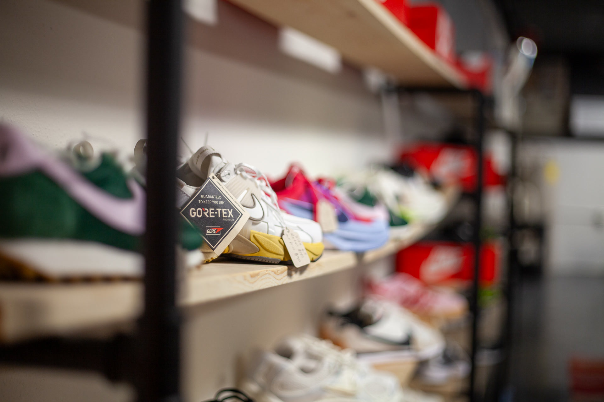 Wall of sneakers and shoes on display at Nine99 — Nike, Jordan, and more